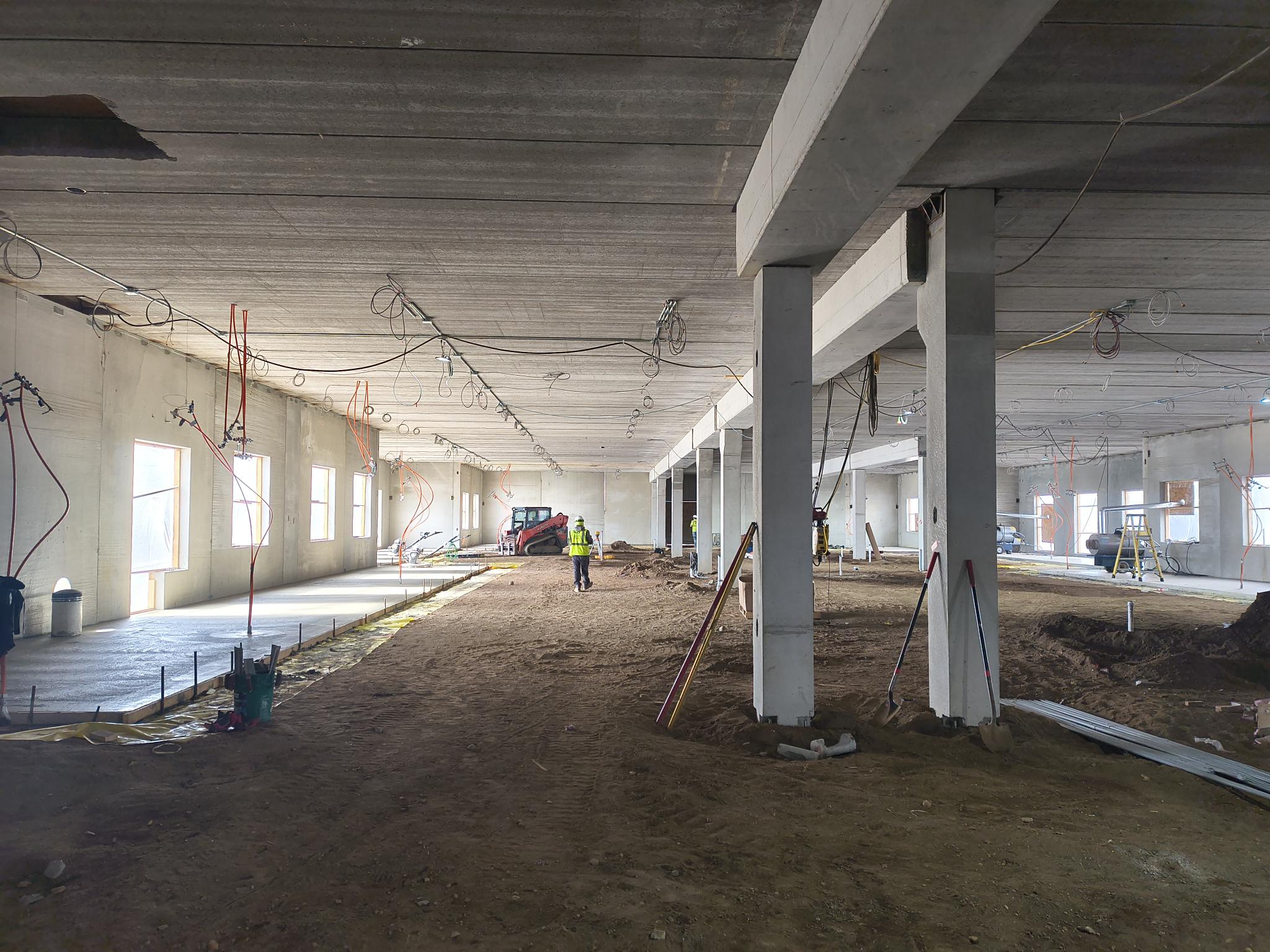 Manifolds for the in-floor heat are placed in a wall and then located above the ceiling. This allow for individual control of temperature in different rooms.