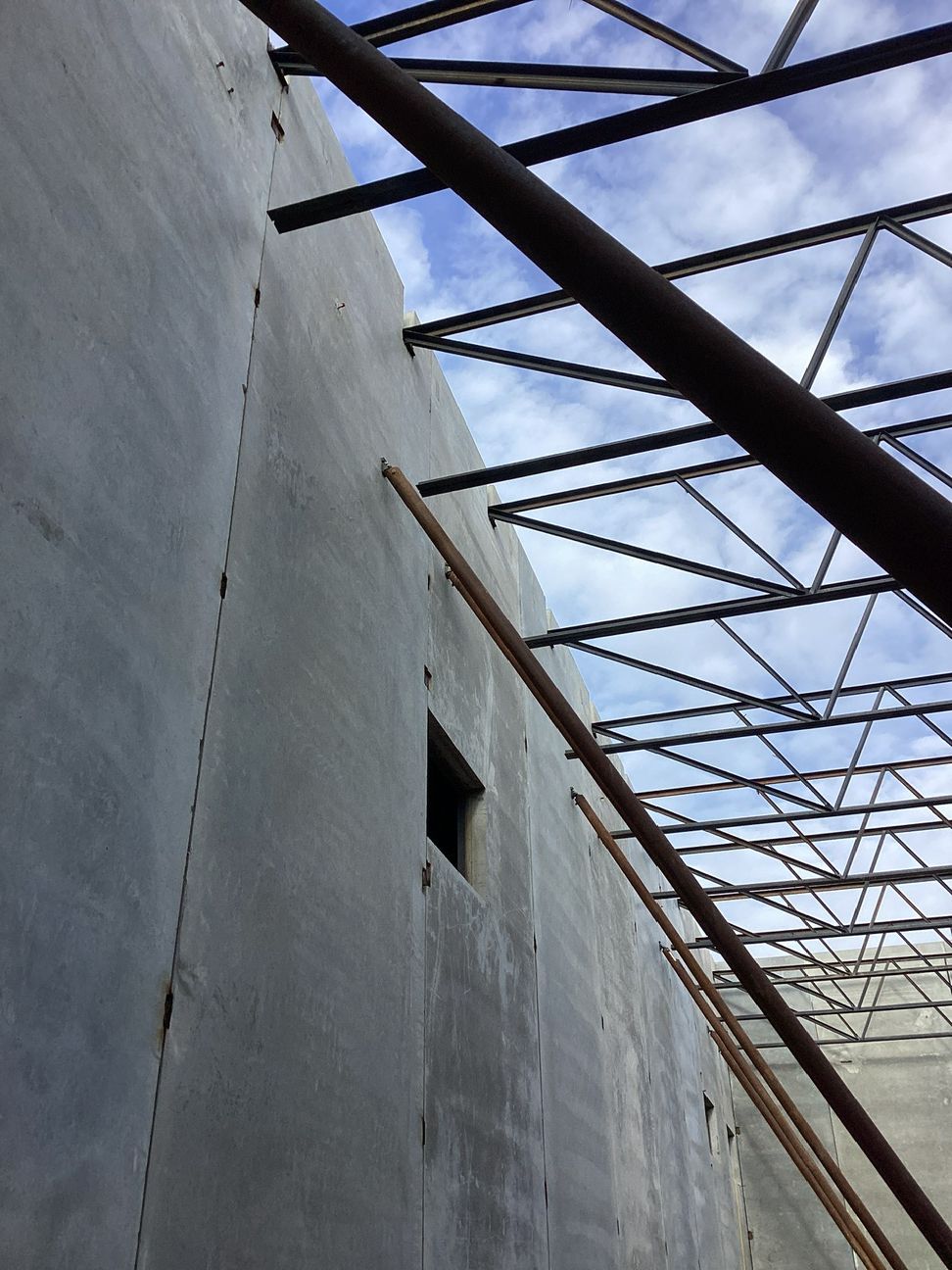 Joists are placed into “pockets” within the precast wall.