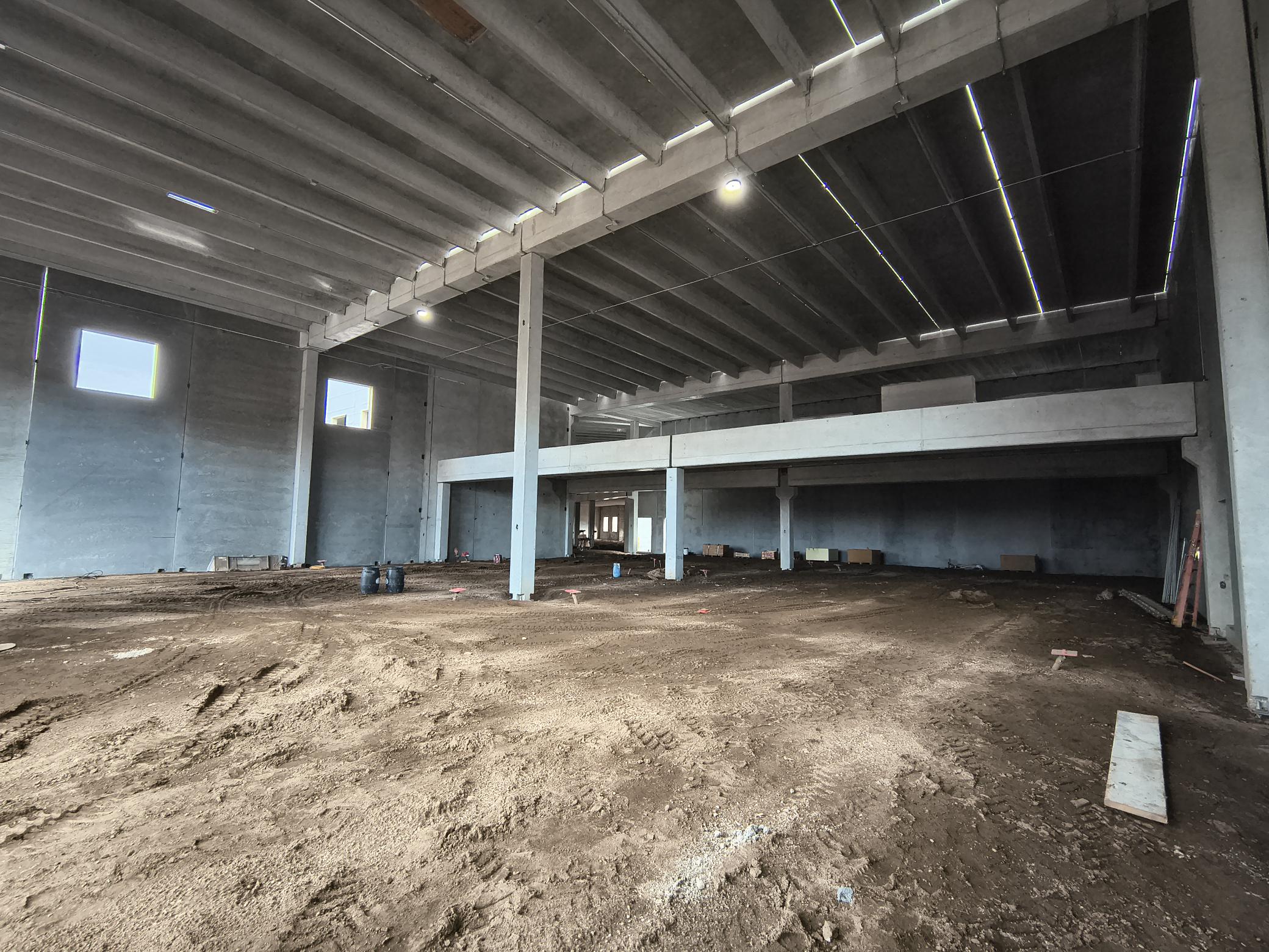 This view is standing in the wood shop. The space will be sectioned off for Ag, Metals, and Woods. The upper level mezzanine classrooms will look down into the shop spaces.